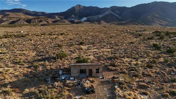 a view of house with mountain view