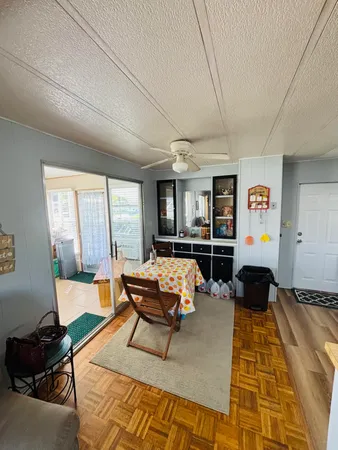 a living room with furniture fireplace and a window