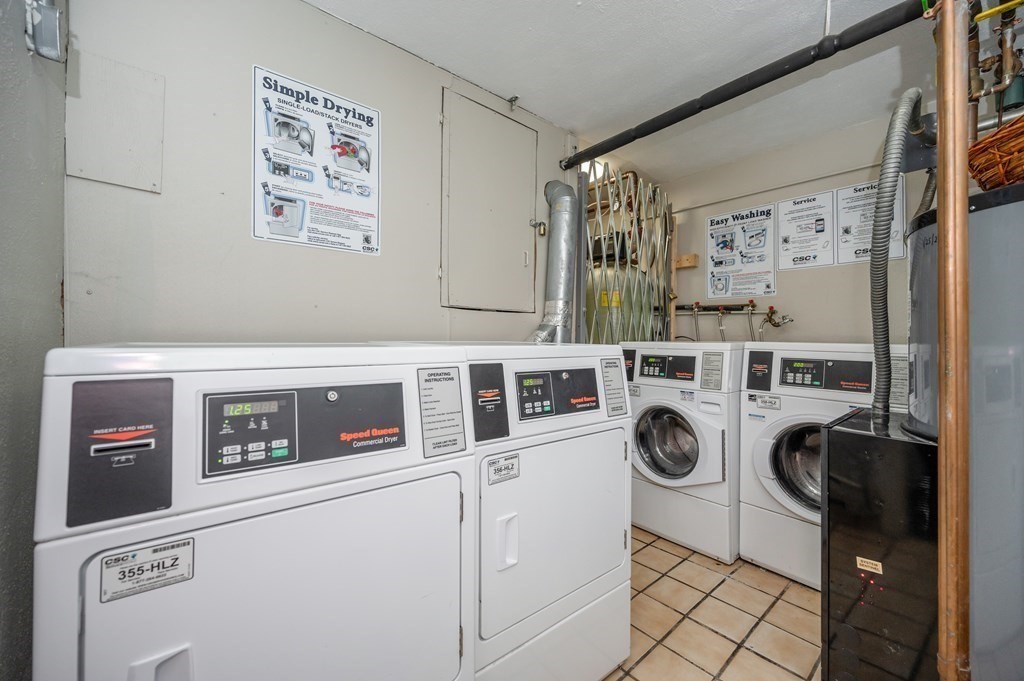 300 Swanson Road, Unit 218 Boxborough, MA 01719 - Photo 18 of 23 a utility room with stainless steel appliances a washer and dryer