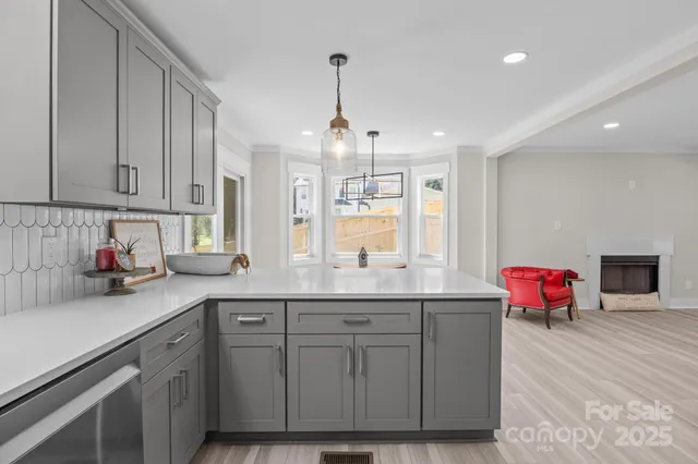 a kitchen with sink cabinets and window