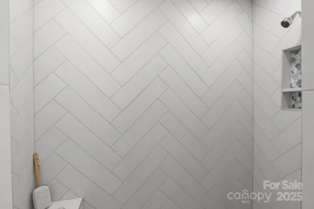 a bathroom with white walls