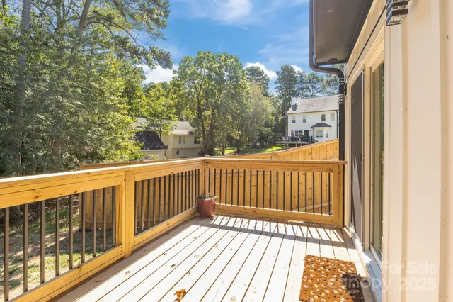 a view of balcony with wooden floor