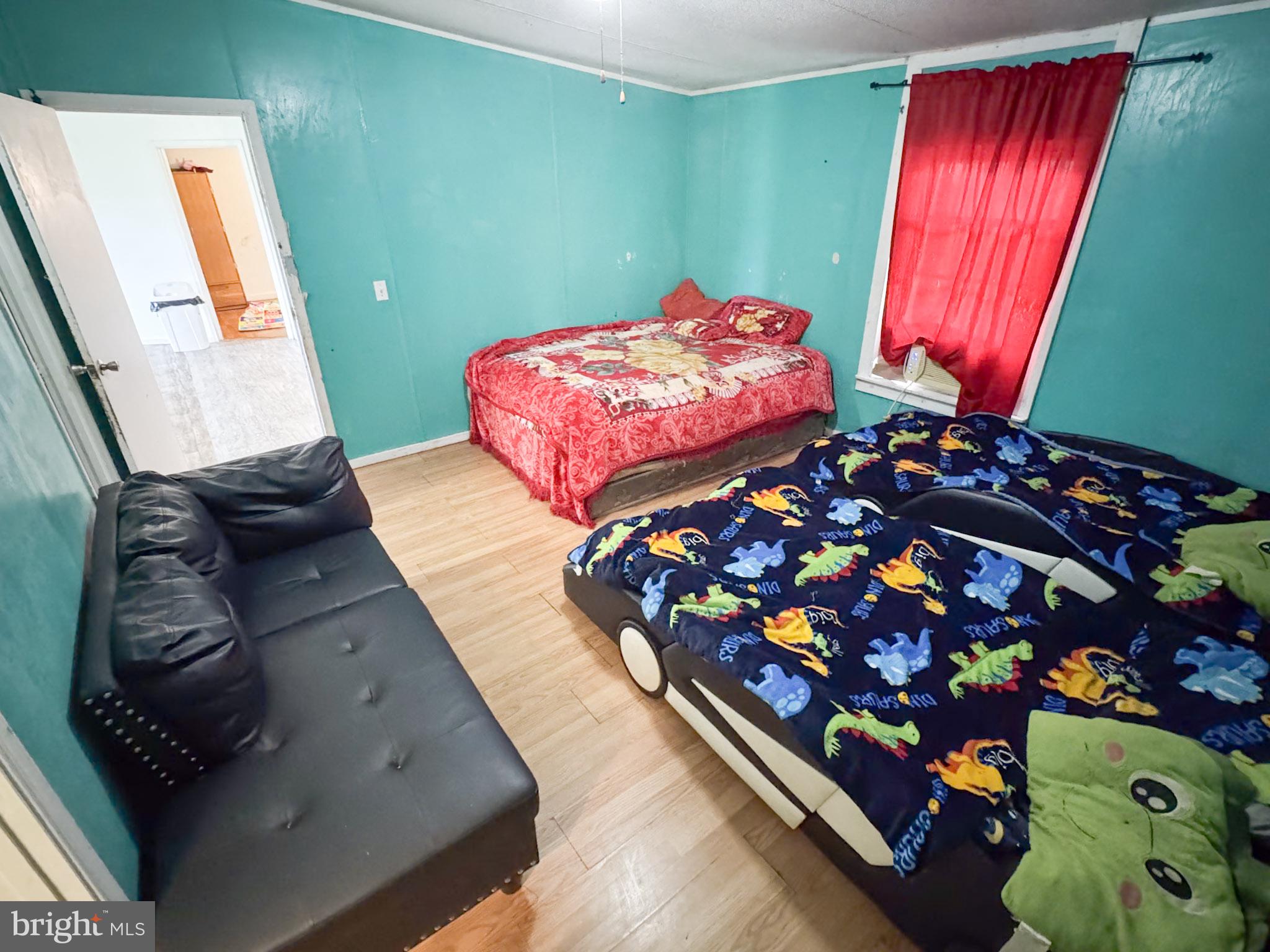 4512 Woodpecker Road Seaford, DE 19973 - Photo 19 of 32 Cozy room with vibrant teal walls.