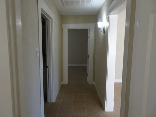 a bathroom with a toilet and shower