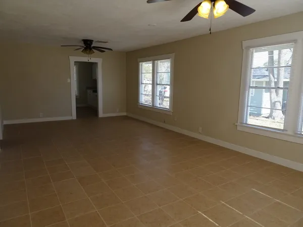 a view of an empty room with a window