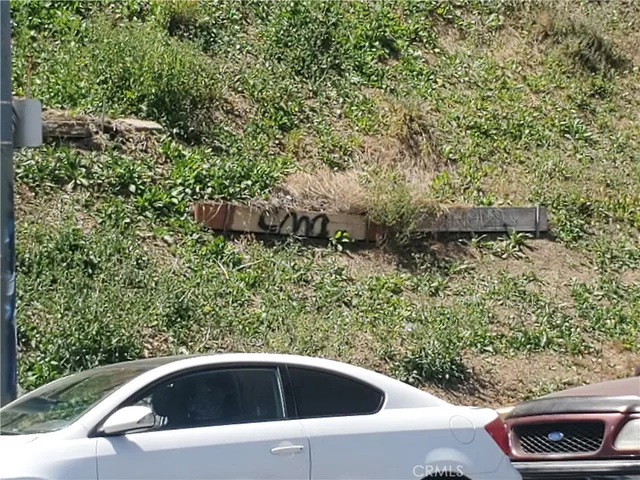 a view of a street with cars