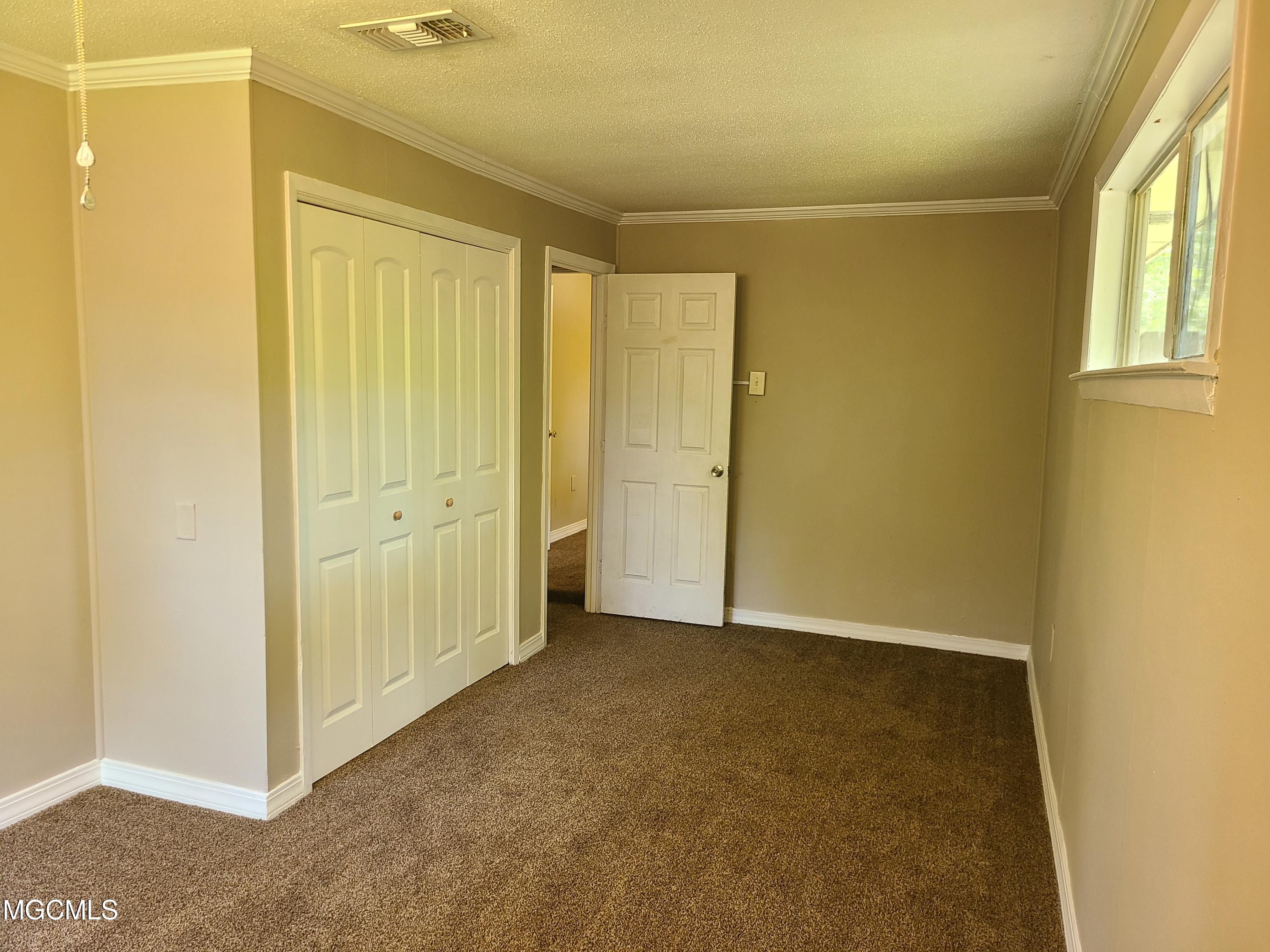 245 Reinike Road Long Beach, MS 39560 - Photo 23 of 25 Back Bedroom