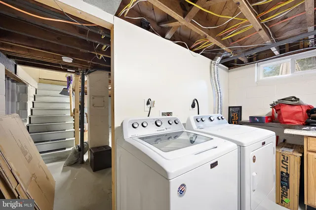 a utility room with dryer and washer
