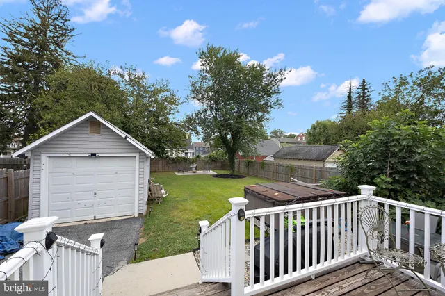 a view of a wooden deck and a yard
