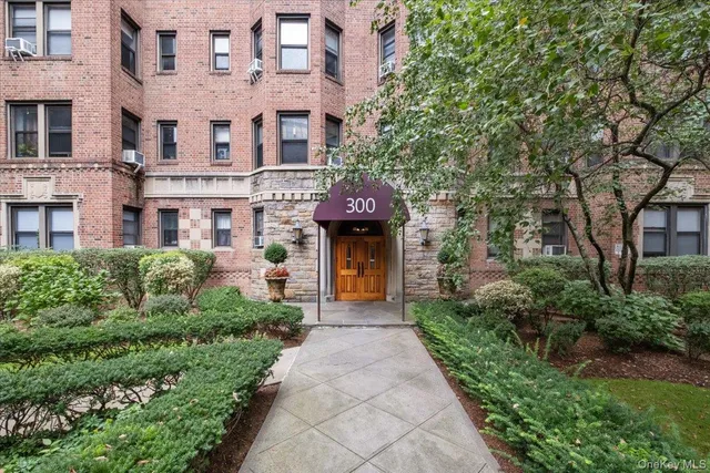 a front view of a building with an outdoor space