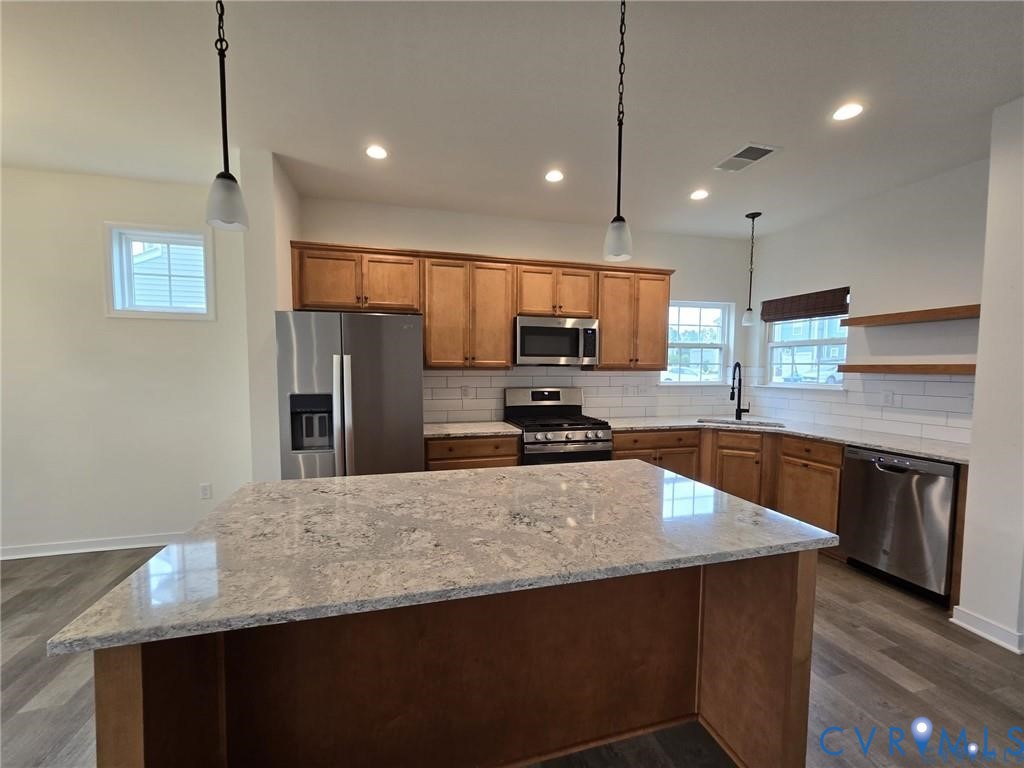 7825 Old Guild Road Richmond, VA 23237 - Photo 9 of 27 Kitchen featuring a large island with a light-colo