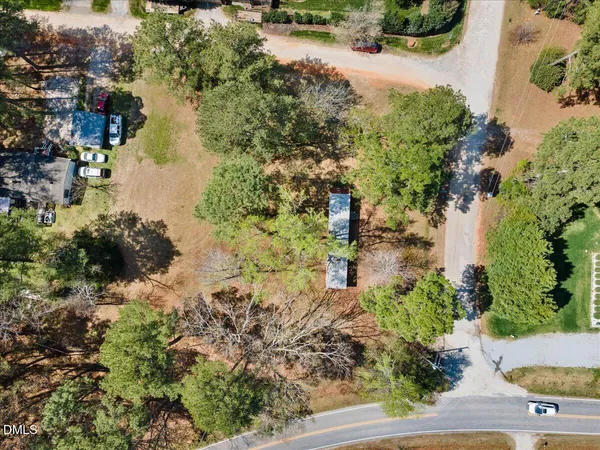 an aerial view of ocean with residential house with green space