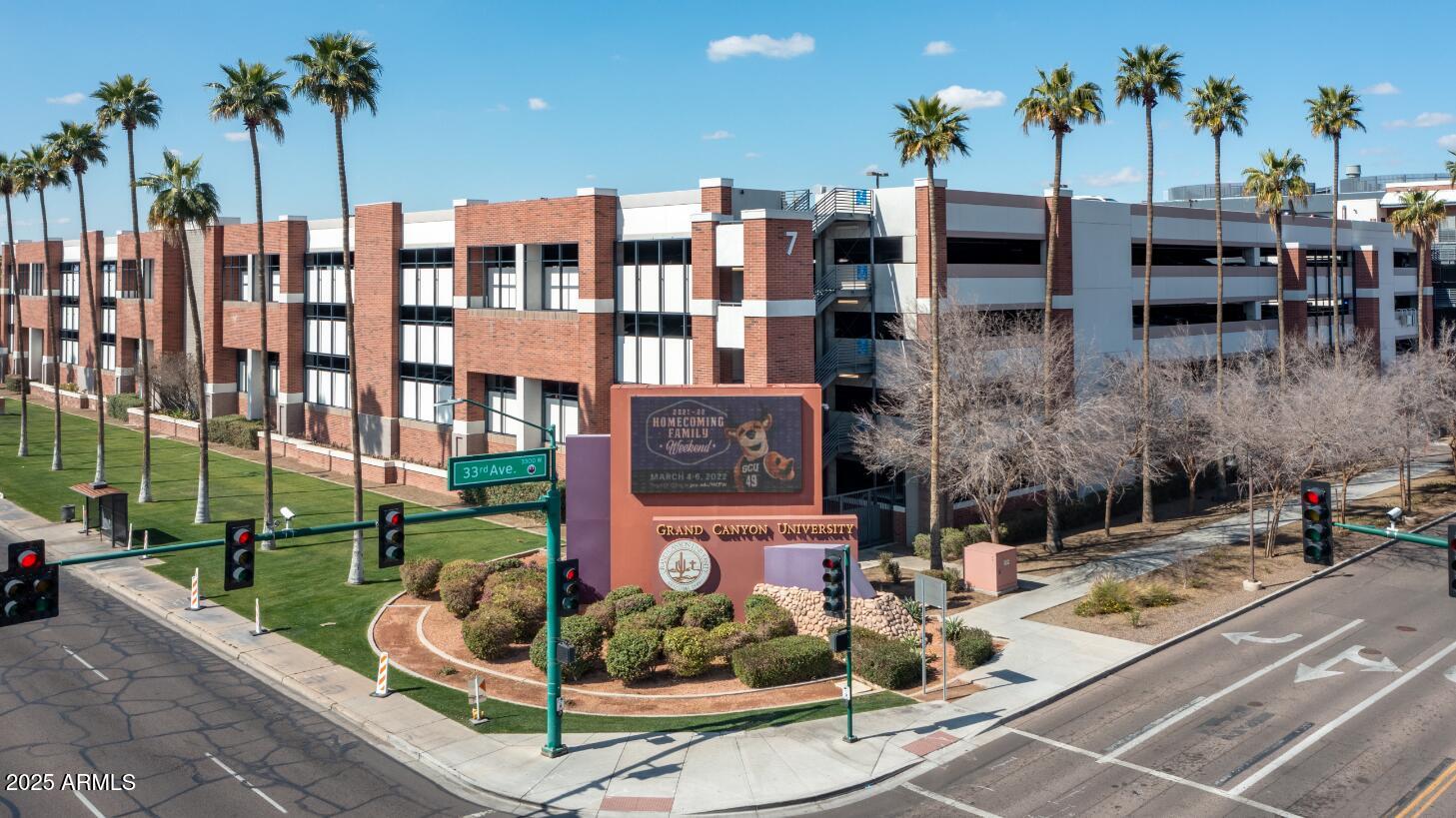 2739 West Rancho Drive Phoenix, AZ 85017 - Photo 27 of 33 a view of a patio with table and chairs potted plants and palm trees