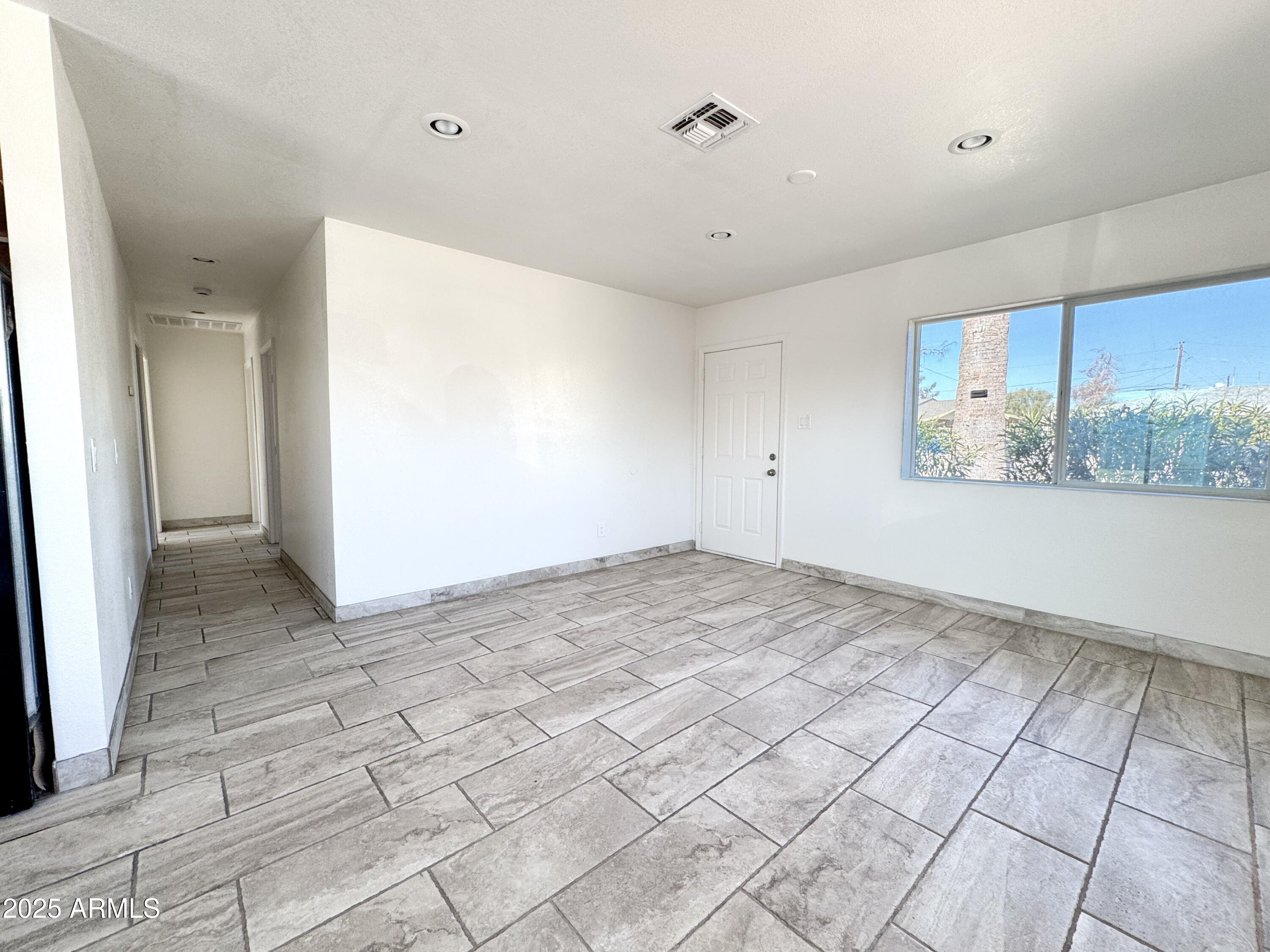 2739 West Rancho Drive Phoenix, AZ 85017 - Photo 6 of 33 a view of a room with a white doors