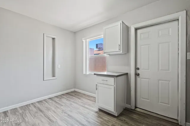 a view of cabinets and wooden floor
