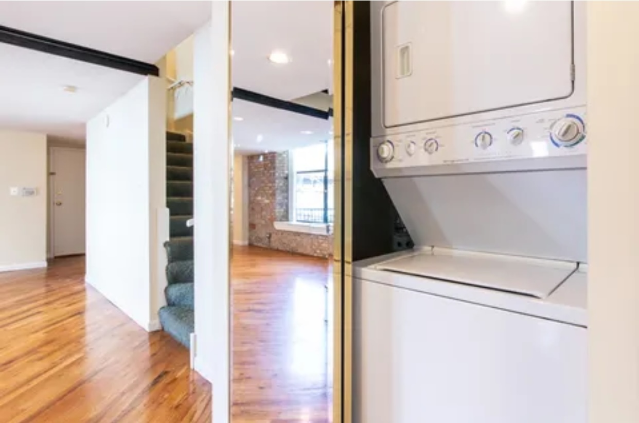 1439 South Michigan Avenue, Unit 101 Chicago, IL 60605 - Photo 11 of 14 a view of washer and dryer with wooden floor