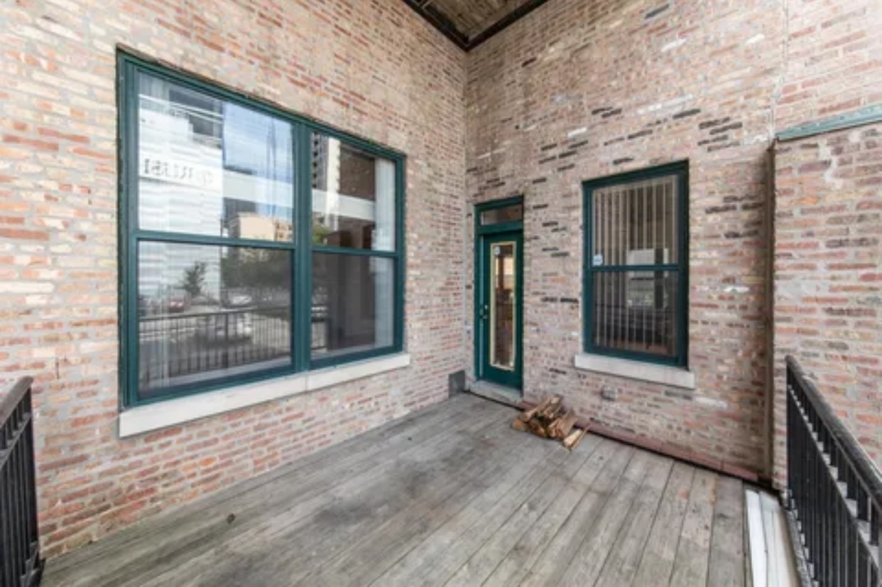 1439 South Michigan Avenue, Unit 101 Chicago, IL 60605 - Photo 12 of 14 a view of front door of house with wooden floor