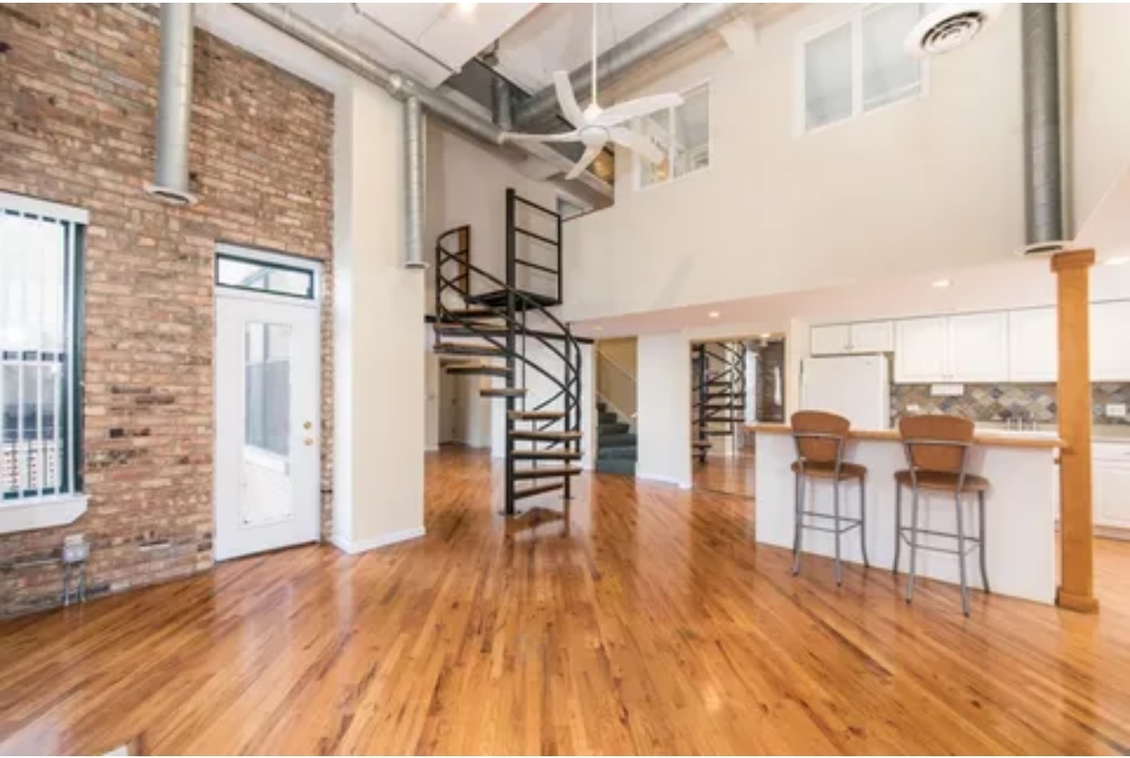 1439 South Michigan Avenue, Unit 101 Chicago, IL 60605 - Photo 5 of 14 a view of a living room and balcony with furniture