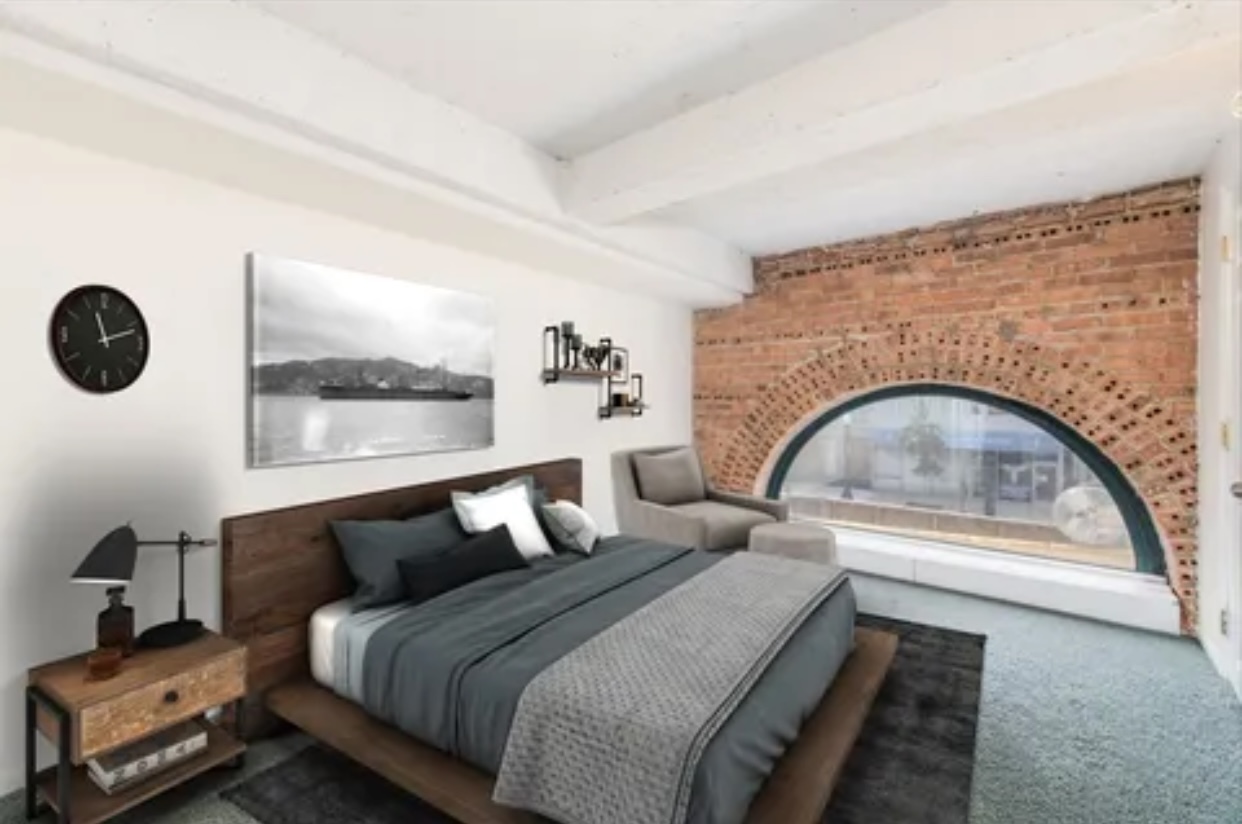 1439 South Michigan Avenue, Unit 101 Chicago, IL 60605 - Photo 10 of 14 a bedroom with bed and a large window