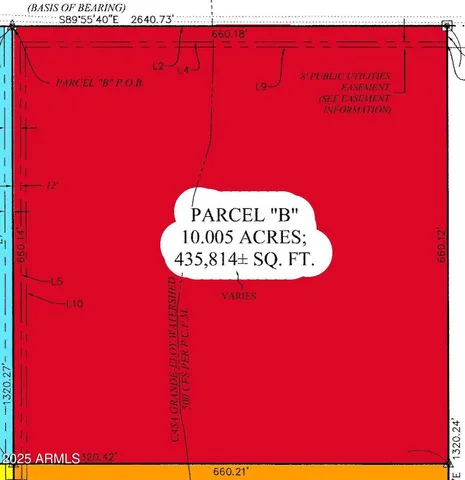 a close up of a red wall with a kitchen