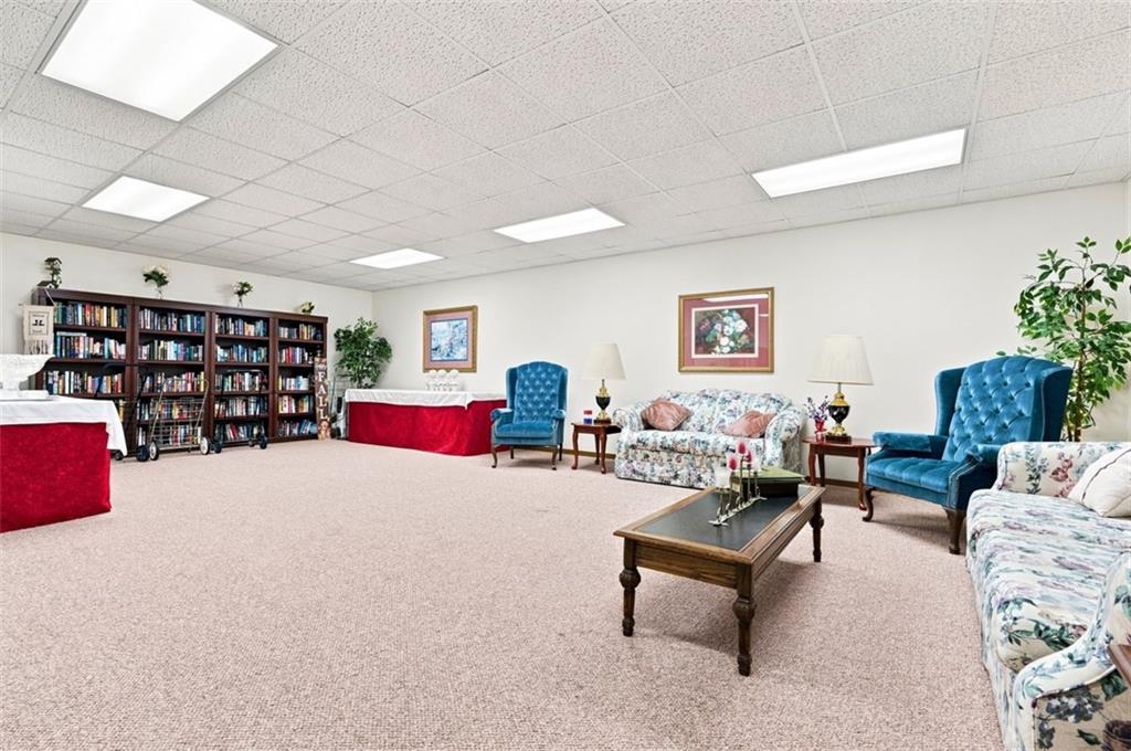 2850 Edgecliff Road, Unit 35 Lower Burrell, PA 15068 - Photo 21 of 28 Common space with library on main level.