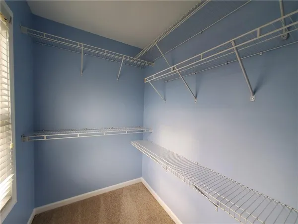 a view of an empty walk in closet