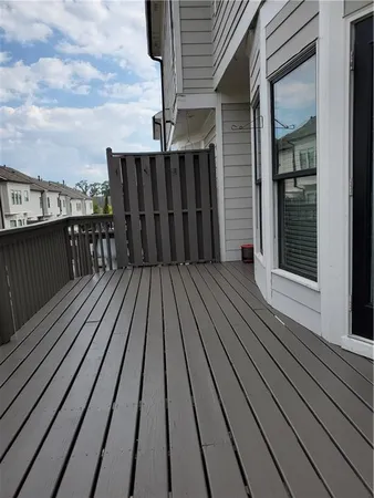 a balcony with wooden floor