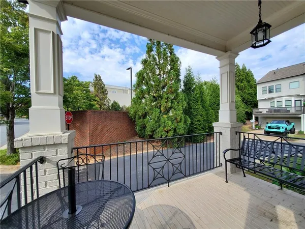 a view of balcony with furniture