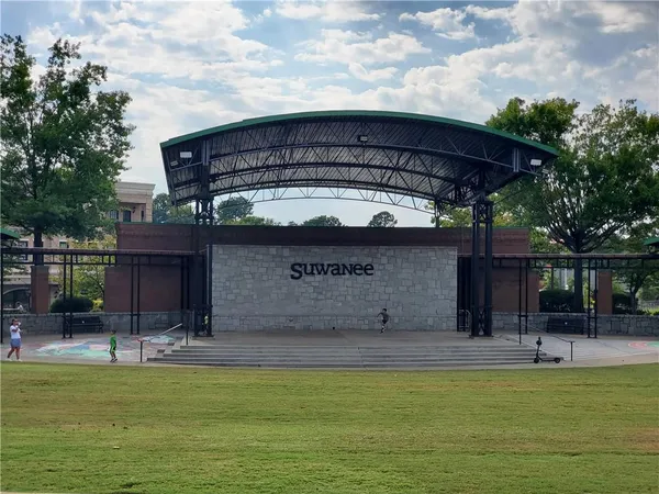 a view of a swimming pool with a bench