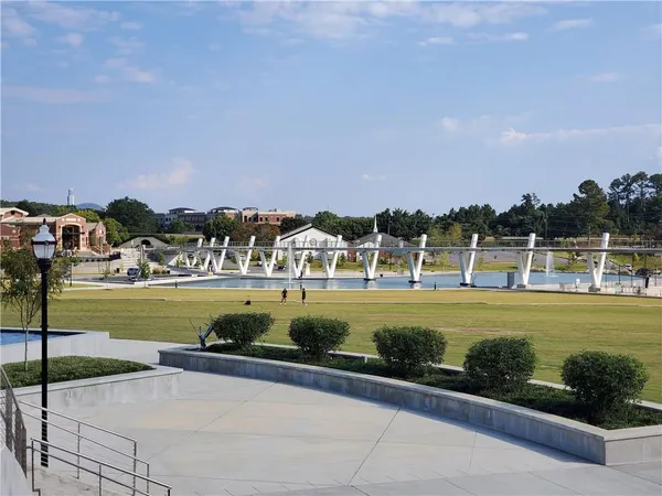 a view of a lake with outdoor seating space
