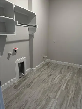 a room with a fireplace and wooden floor