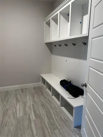 a kitchen with a cabinets and white appliances