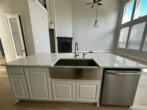 a kitchen with a sink and a refrigerator