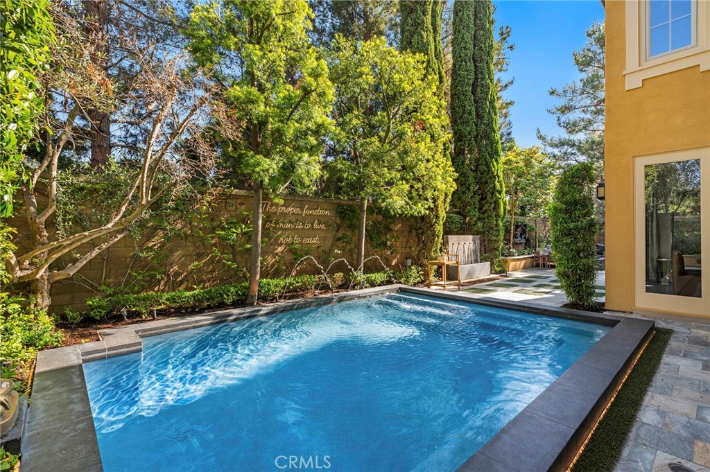 24 Tesoro Irvine, CA 92618 - Photo 24 of 75 a view of a patio with table and chairs and potted plants