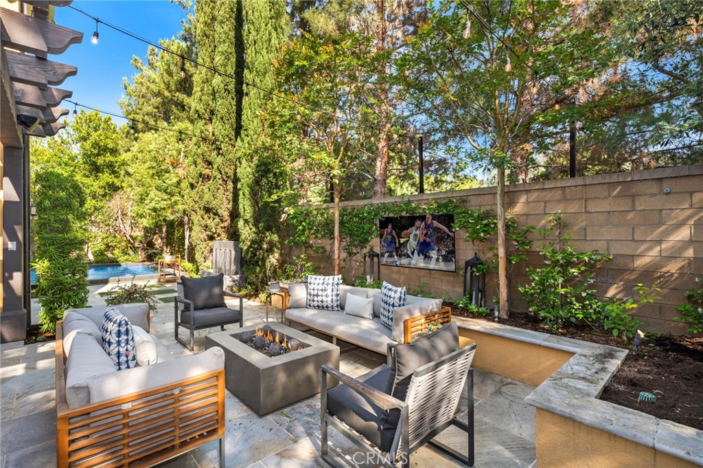 24 Tesoro Irvine, CA 92618 - Photo 26 of 75 a view of a patio with couches table and chairs and potted plants