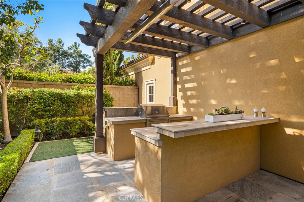 24 Tesoro Irvine, CA 92618 - Photo 31 of 75 a view of a kitchen with a sink and wooden floor
