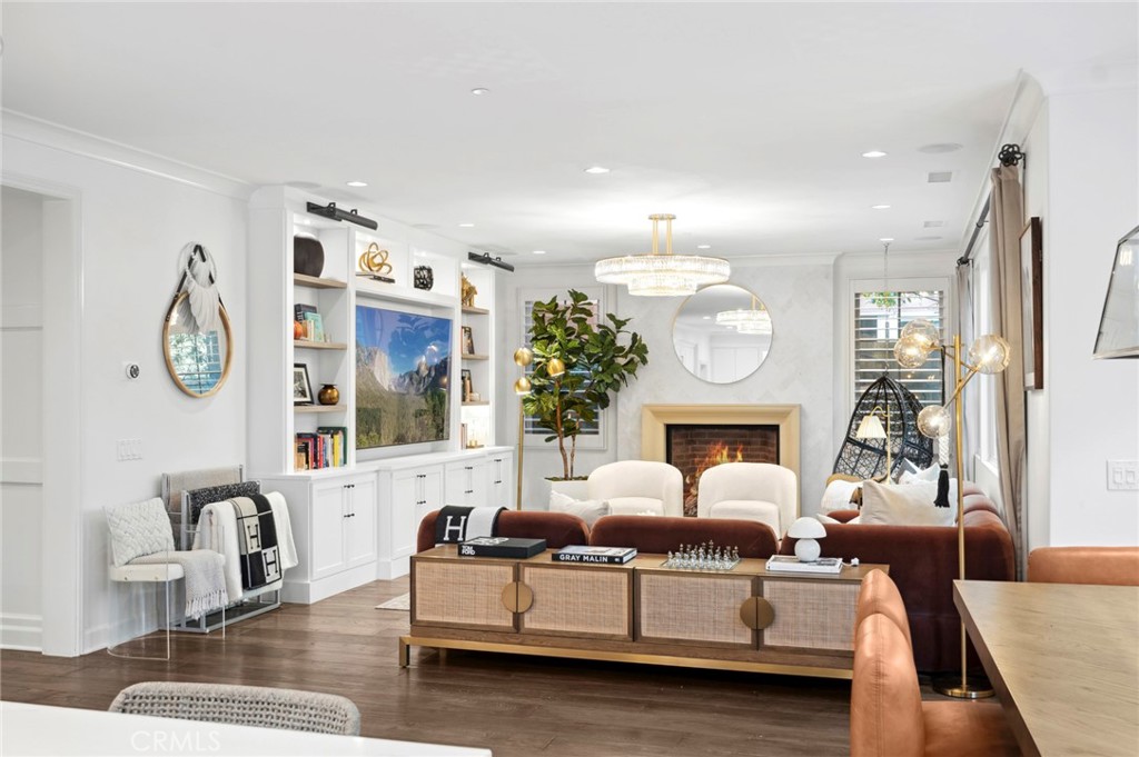 24 Tesoro Irvine, CA 92618 - Photo 35 of 75 a living room with furniture a fireplace and a large mirror