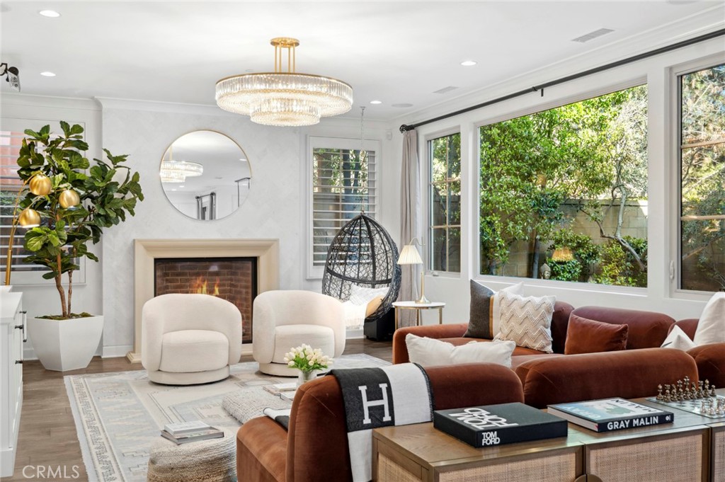 24 Tesoro Irvine, CA 92618 - Photo 37 of 75 a living room with furniture a fireplace and a large window