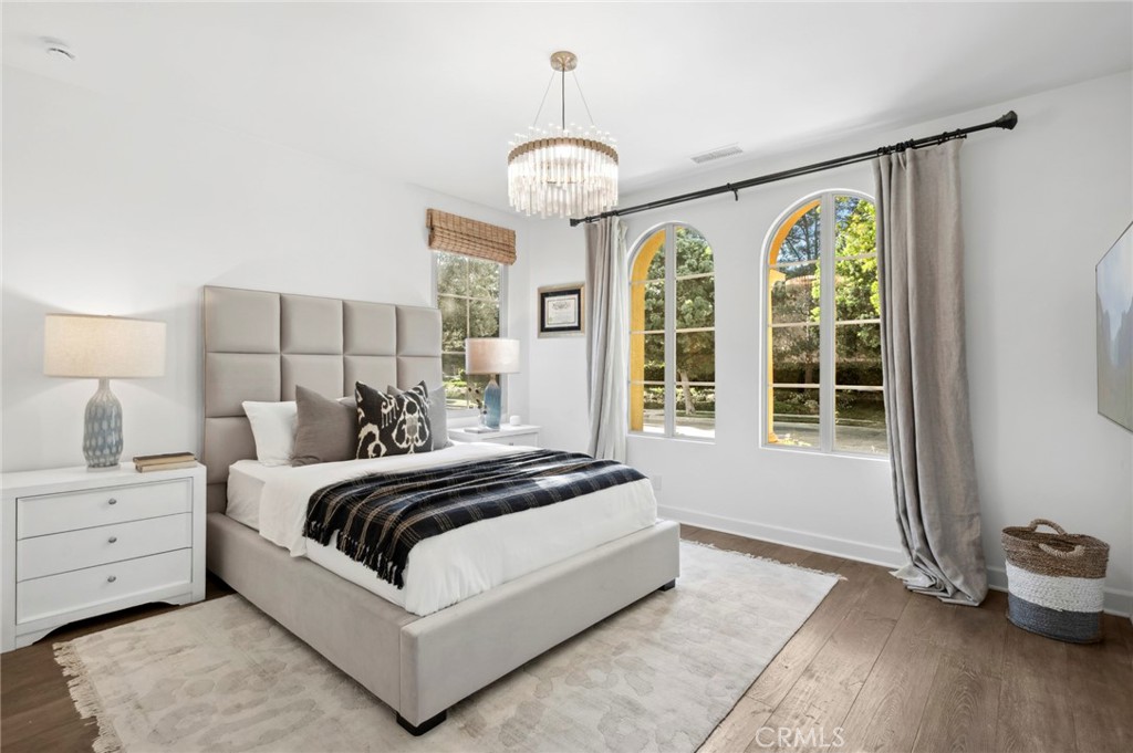 24 Tesoro Irvine, CA 92618 - Photo 38 of 75 a spacious bedroom with a bed and a window