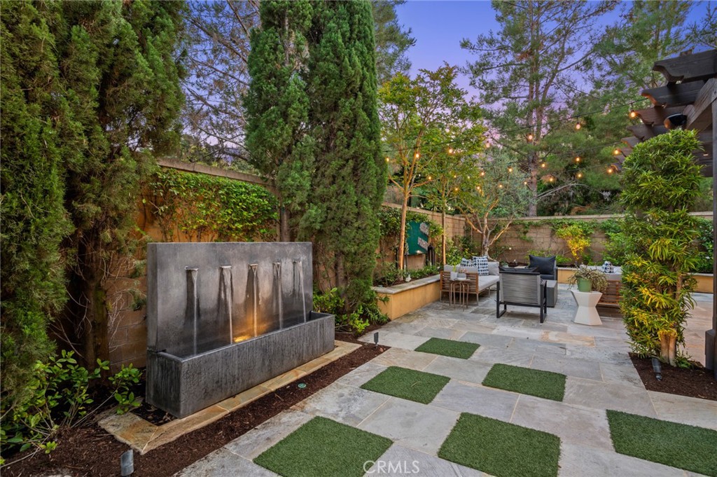 24 Tesoro Irvine, CA 92618 - Photo 4 of 75 a view of a patio with table and chairs with wooden floor and plants