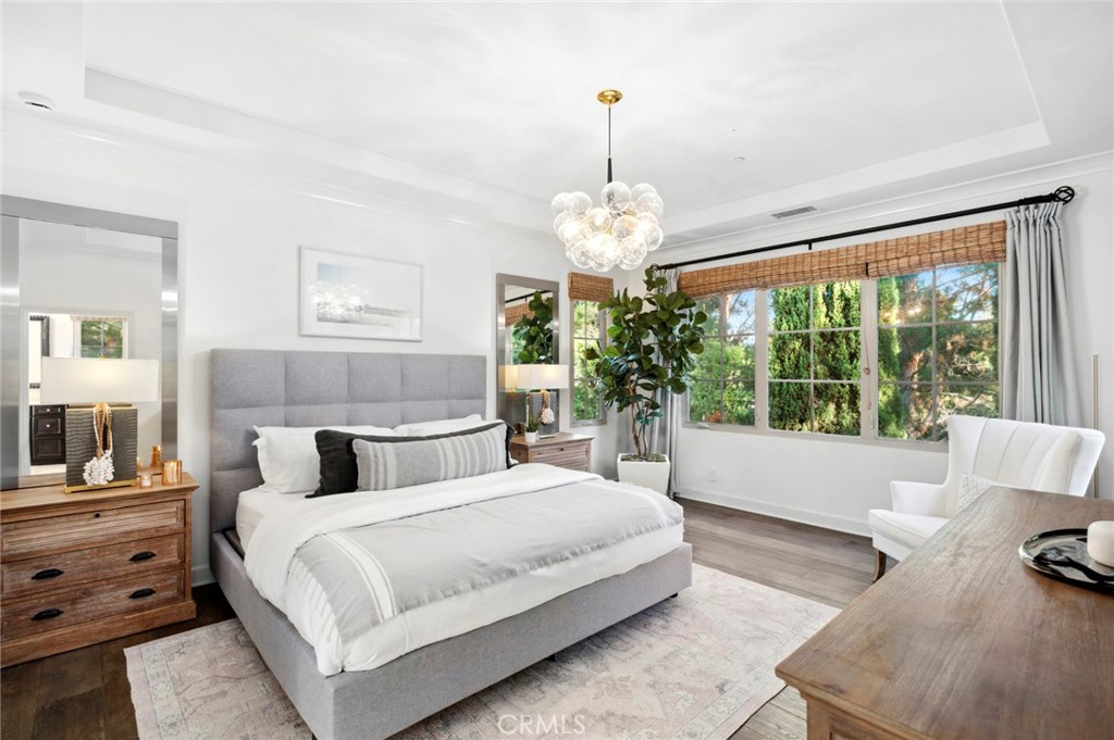 24 Tesoro Irvine, CA 92618 - Photo 43 of 75 a spacious bedroom with a bed and a window