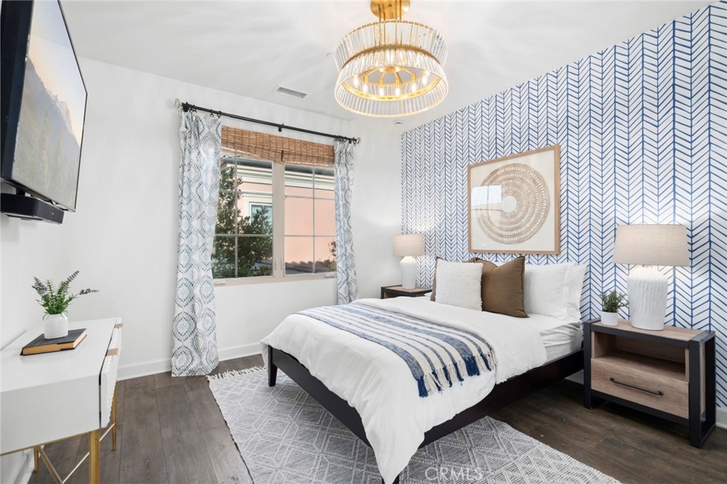 24 Tesoro Irvine, CA 92618 - Photo 51 of 75 a bedroom with a bed and a chandelier
