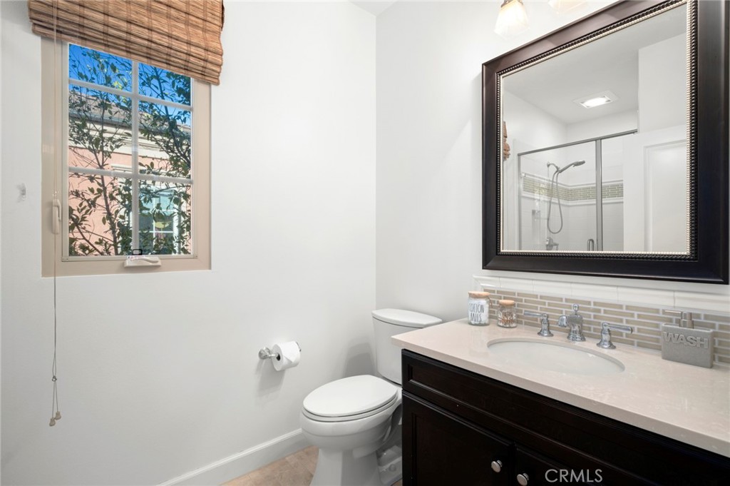 24 Tesoro Irvine, CA 92618 - Photo 53 of 75 a bathroom with a sink and a mirror
