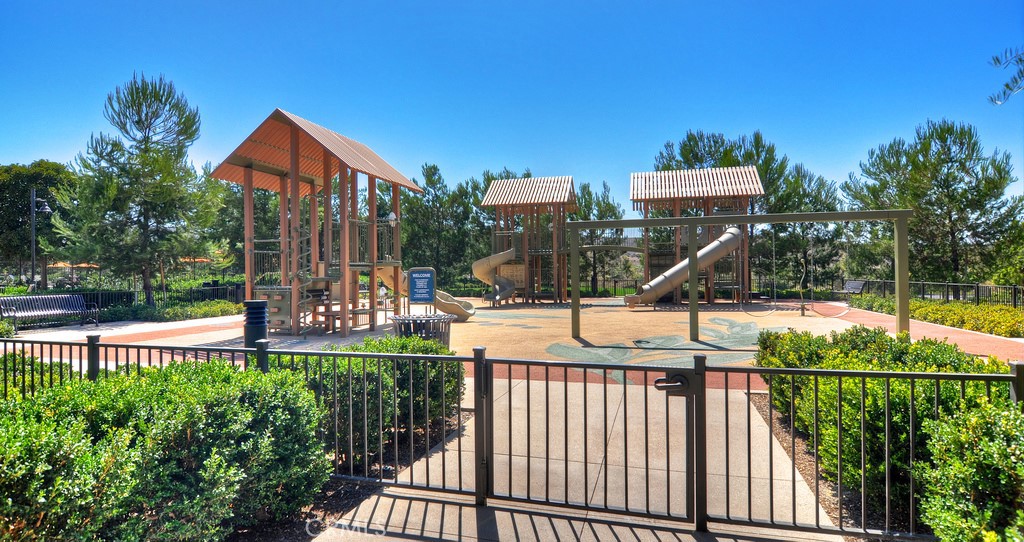24 Tesoro Irvine, CA 92618 - Photo 62 of 75 a view of a house and a yard and a wooden deck