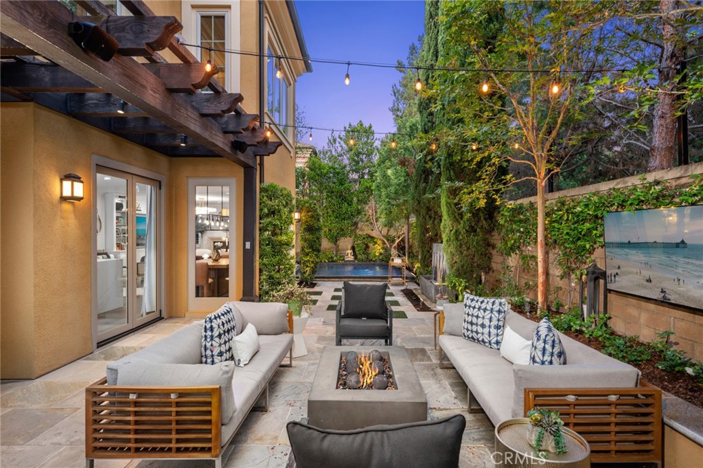 24 Tesoro Irvine, CA 92618 - Photo 8 of 75 a view of a patio with couches table and chairs and potted plants