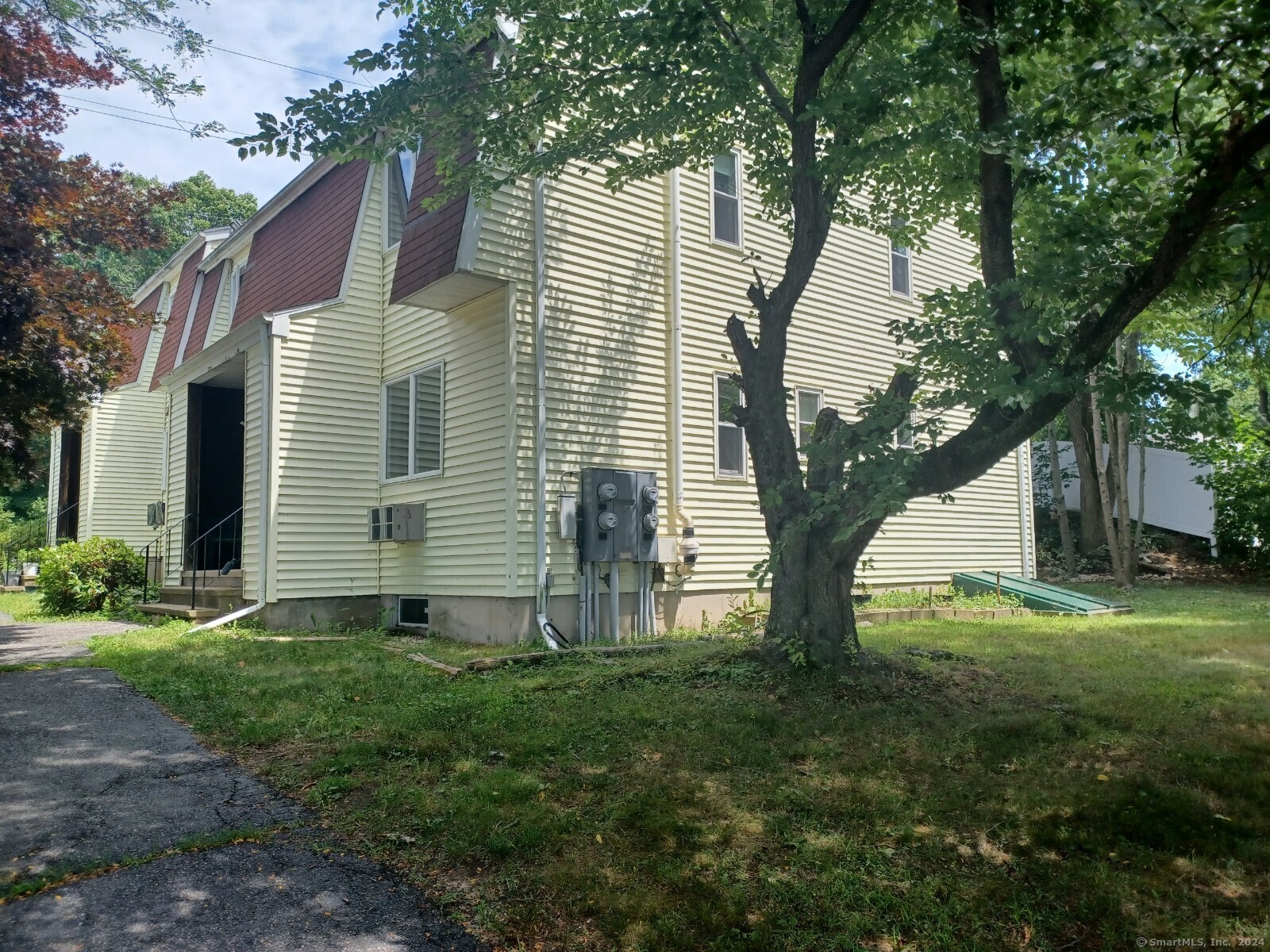 21 Oak Ave Extension, Unit 6 Torrington, CT 06790 - Photo 1 of 1 a view of a house with backyard and a tree