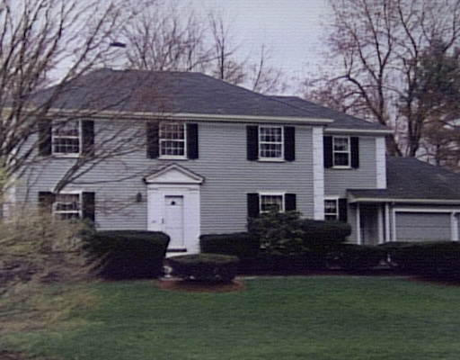 23 White Oak Road Wellesley, MA 02481 - Photo 1 of 1 a front view of a house with a garden