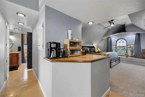 a view of living room with granite countertop furniture and a fireplace