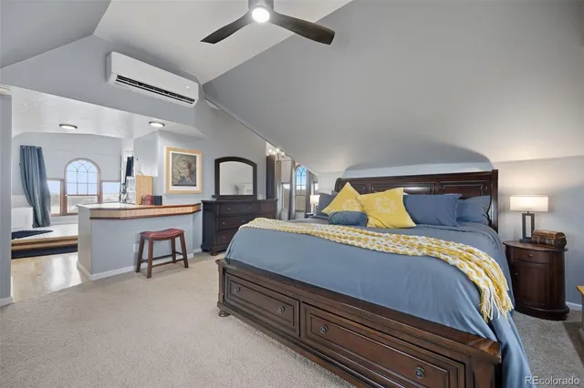 a bedroom with bed and window