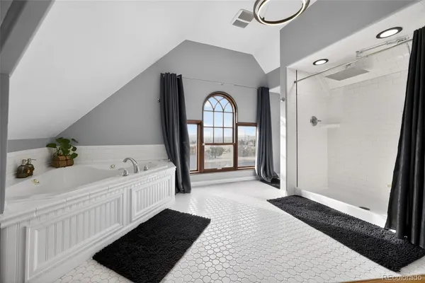a large spacious bathroom with a double vanity sink and a mirror